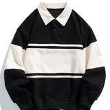 Jan | Polosweater met patchworkdetails en kleurvlakken en relaxte pasvorm
