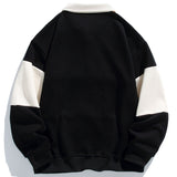 Jan | Polosweater met patchworkdetails en kleurvlakken en relaxte pasvorm