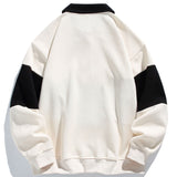 Jan | Polosweater met patchworkdetails en kleurvlakken en relaxte pasvorm