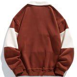 Jan | Polosweater met patchworkdetails en kleurvlakken en relaxte pasvorm