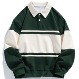 Jan | Polosweater met patchworkdetails en kleurvlakken en relaxte pasvorm
