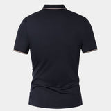 Melchior | Marineblauwe polo met contrastbies