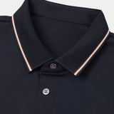 Melchior | Marineblauwe polo met contrastbies