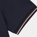 Melchior | Marineblauwe polo met contrastbies