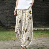 Marguerite – Brede, crèmekleurige broek met bloemenpatroon