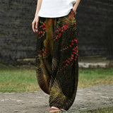 Camille – Brede broek in donkergroene kleur met botanisch patroon