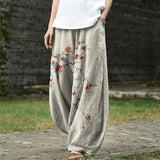 Denise – Beige brede broek met rode bladerenmotieven