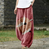 Jacqueline – Brede broek met roze vogelmotief