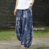 Éliane – Brede blauwe broek met pruimenbloemmotief